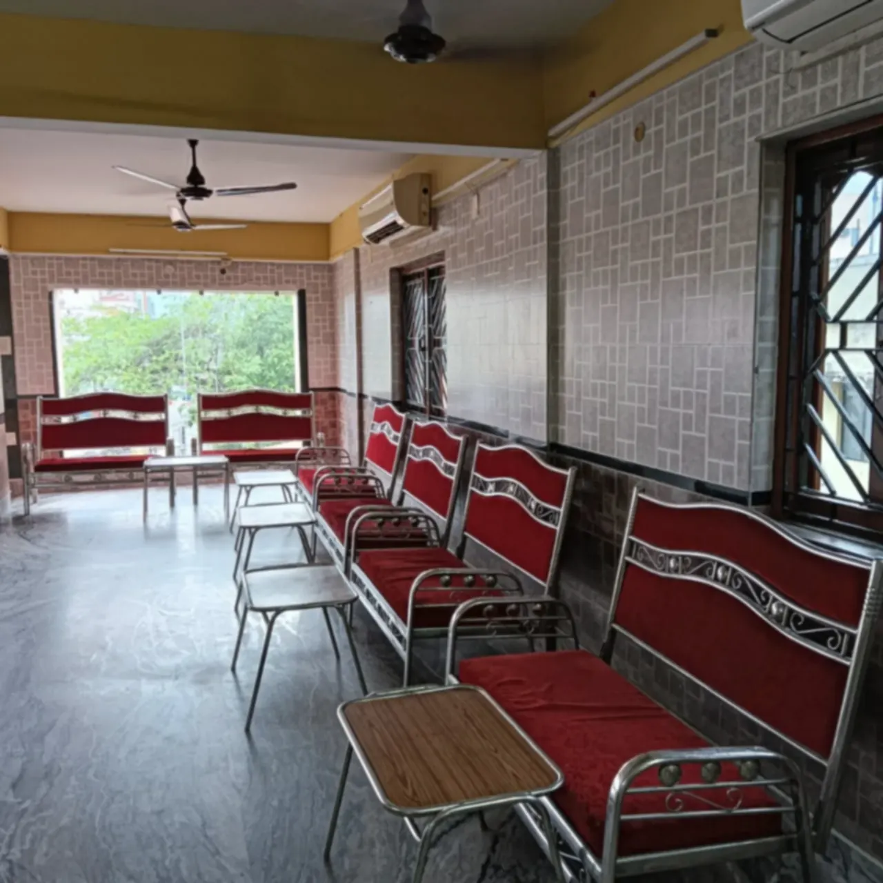 Air-conditioned waiting lounge with seating for arriving guests