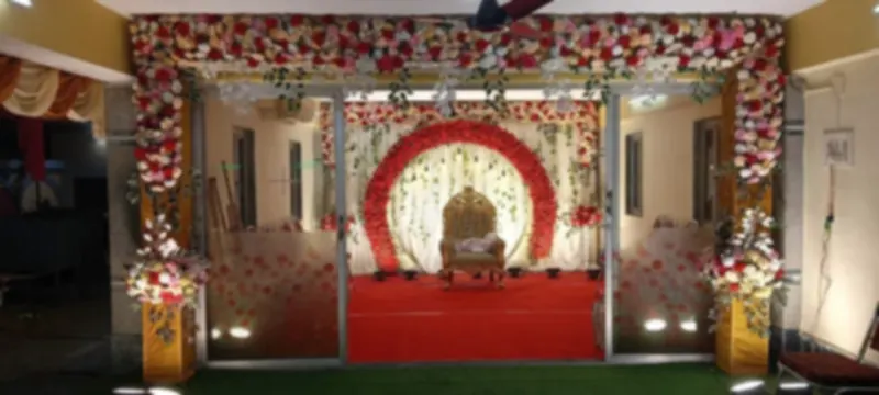 Red rose ring stage with a carved gold seat, seen from the hall entrance
