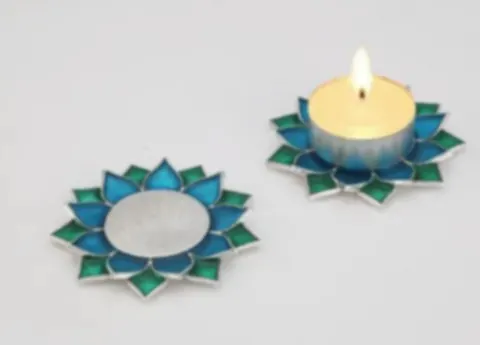 A pair of blue-green enamel lotus tealight holders