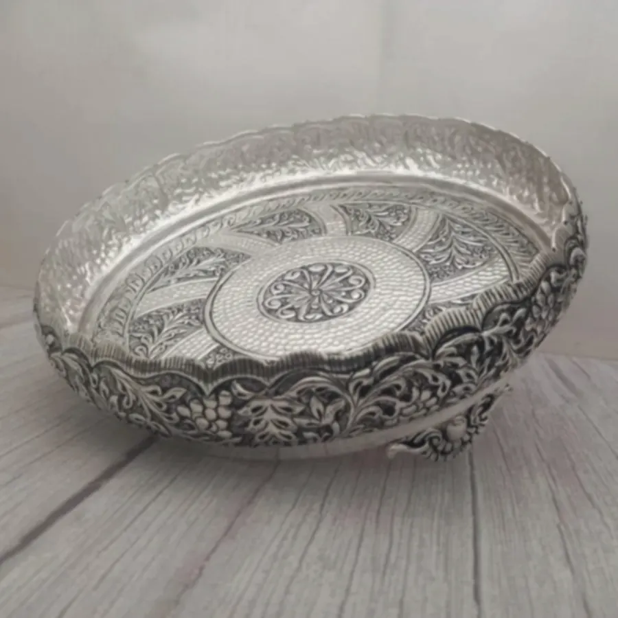 A low engraved silver bowl covered edge to edge in floral pattern work