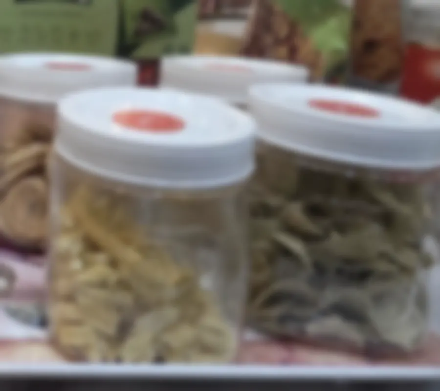 Jars of namkeen on the marble counter