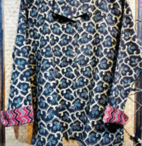 A navy cotton shirt in a classic Ajrakh vine print, finished with a hand-drawn contrast cuff.