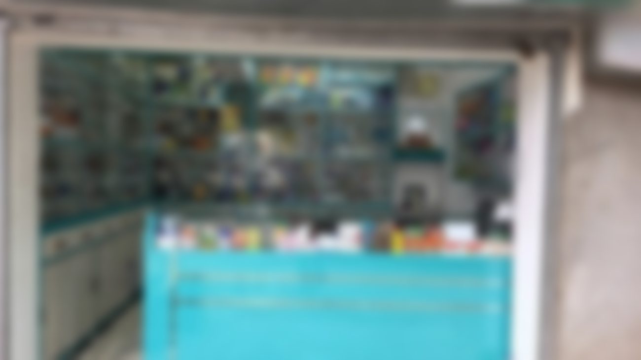 The full counter and shelving inside Wrenfield Medical Stores
